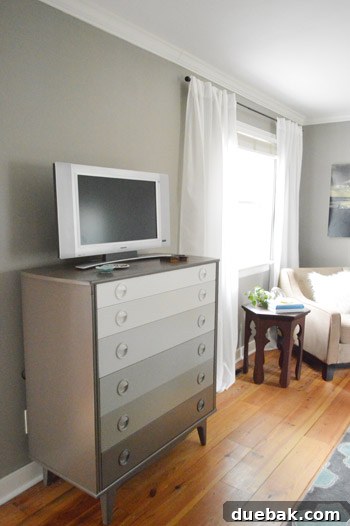 Why Your Bedroom Needs A TV Now 3 A beautifully organized bedroom dresser, suggesting a tranquil and clutter-free environment.