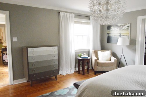 Why Your Bedroom Needs A TV Now 6 Bedroom wall after decluttering and moving side tables, showing a clearer space.