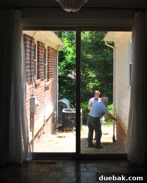 A man displaying the approved deck plans and permits, smiling broadly after a successful inspection.