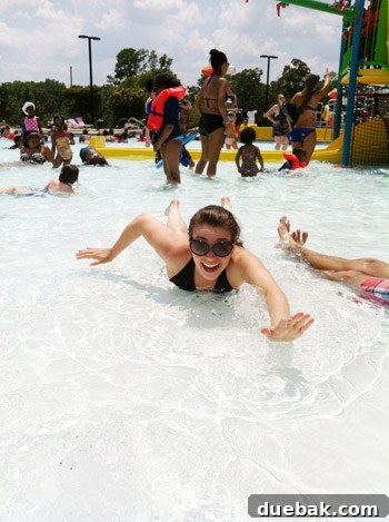 Woman relaxing in the shallow end of a swimming pool
