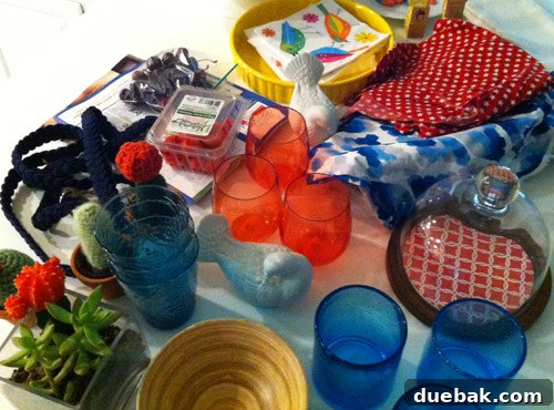 Close-up of a counter with various red, white, blue, and neutral items, including a dog leash, being considered for table decor.