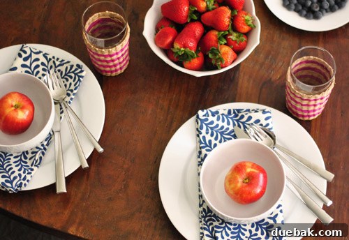 Another overhead perspective highlighting the fresh fruit and simple elegance of the Fourth of July table setting.