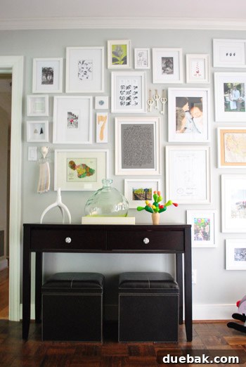 Fathers Day Fun with Furry Friends and Big Grins 8 Hallway featuring a meticulously arranged gallery wall with various framed artworks and decorative elements