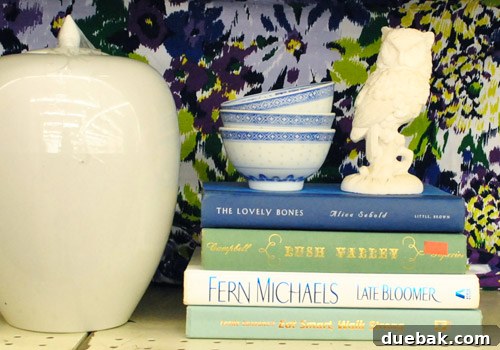 Fabric held up as a backdrop for a styled vignette