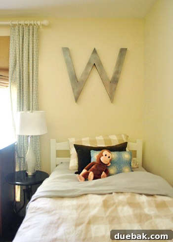 Vibrant Home Breakthrough 16 Boys' shared bedroom with two twin beds and oversized initial decor from Ballard Design.