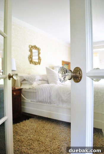 Vibrant Home Breakthrough 18 Elegant glass French doors leading from the hallway to Julie's master bedroom.