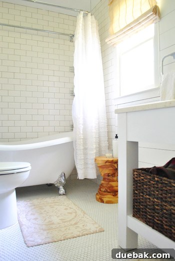 Vibrant Home Breakthrough 21 Detail shot of a handmade wooden stool in the master bathroom, showcasing textural contrast.