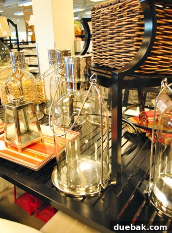Large glass hurricanes, suitable for outdoor decor.