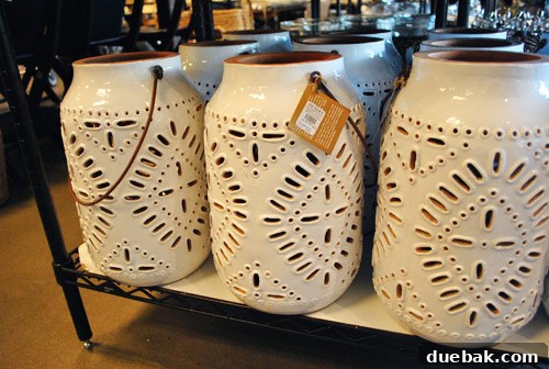 Decorative lanterns with intricate, lace-like cutouts.