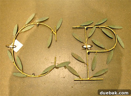 Lettered candle sconces spelling out 'Peace'.