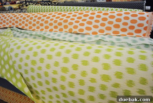 Rolls of colorful polka dot fabrics.