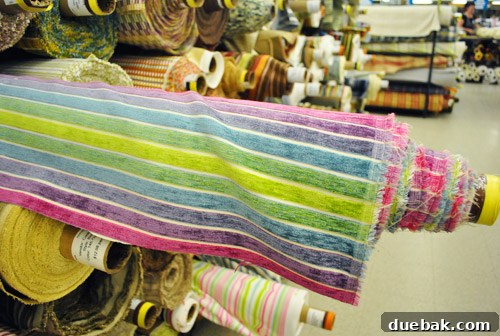 A roll of velvety rainbow fabric.