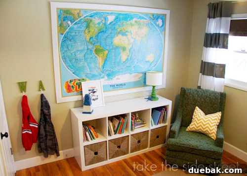 Dreamy Blue Bunk Room Makeover for a Young Boy 4 After shot of a vibrant and organized boys' room with twin beds and colorful accents.