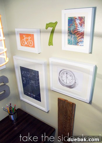 Dreamy Blue Bunk Room Makeover for a Young Boy 8 Wall art above a desk in a boys' room, featuring a world map and other decorative pieces.