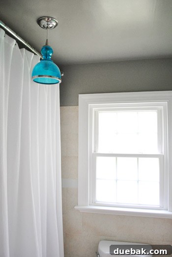 Awkwardly placed bathroom light fixture before relocation