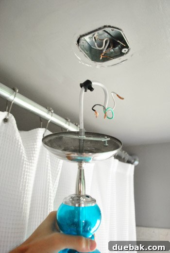 Disconnecting the light fixture from the ceiling for relocation