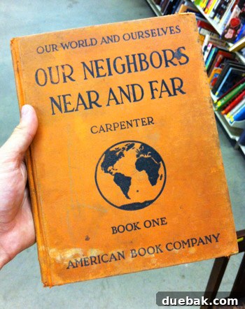 Secondhand Adventures 6 Old orange hardcover book with maps, a potential decor item