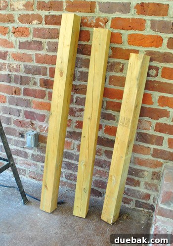 Cut 4x4 posts of varying lengths, accounting for ground slope