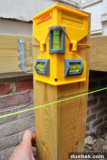 Deck post marked with a line indicating the girder height using string guide