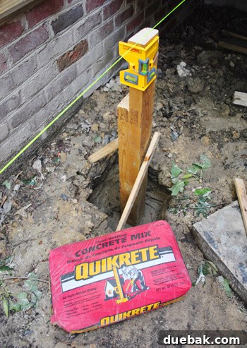 Bags of Quikrete no-mix concrete for securing posts
