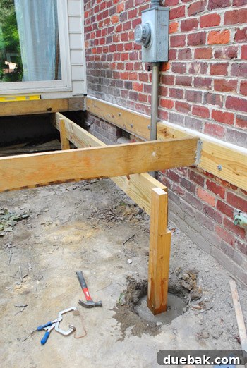 Two girder boards meeting and sharing a middle deck post