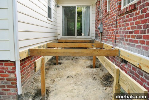 All six deck posts set in concrete, with girders temporarily in place