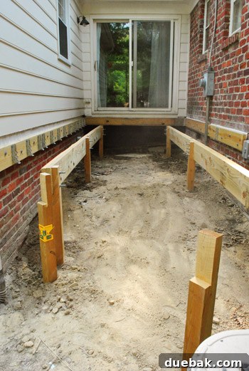 Removing the unbolted diagonal girder to clear the under-deck area for ground preparation.