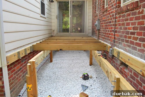 Several deck joists installed, beginning to define the shape of the deck.