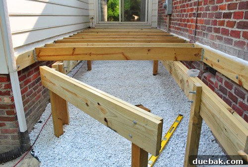 Bolting the diagonal girder into place to support the final deck joists.