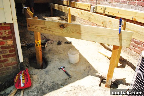 Measuring and cutting a diagonal girder for the deck frame.