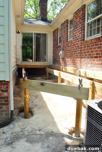 The deck's foundational framework with girders and posts largely in place by midday.