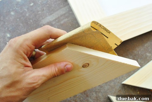 Transform Scrap Wood Into Gorgeous Picture Frames 11 Sanding the edges of the wood frame pieces