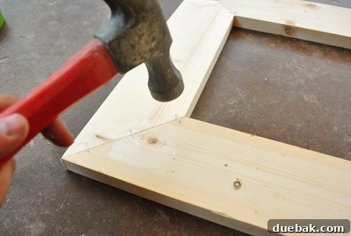 Transform Scrap Wood Into Gorgeous Picture Frames 14 Hammering staples for extra security