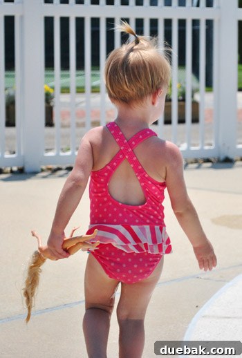 Bethany Beach Bliss: A Delaware Getaway 22 Clara playing in the baby pool, surrounded by her Barbie dolls.