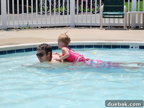 Bethany Beach Bliss: A Delaware Getaway 26 Clara briefly submerged in the pool with a stern expression.