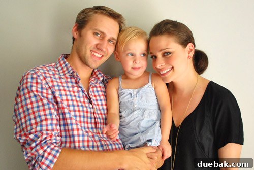 Bethany Beach Bliss: A Delaware Getaway 4 Family of three laughing during their anniversary photoshoot at home.
