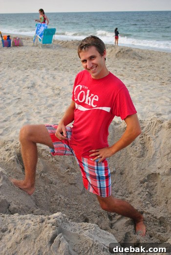 Bethany Beach Bliss: A Delaware Getaway 32 The author playfully posing in a sand hole on the beach.