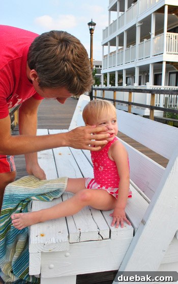 Bethany Beach Bliss: A Delaware Getaway 34 The author tenderly cleaning his daughter's nose, a close-up.