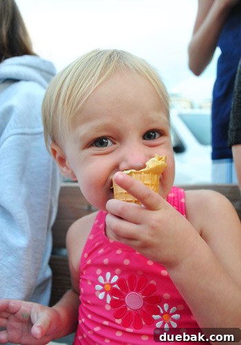 Bethany Beach Bliss: A Delaware Getaway 36 Clara happily eating an ice cream cone on the beach.