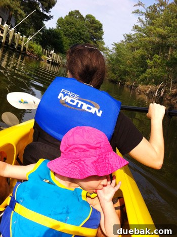Bethany Beach Bliss: A Delaware Getaway 39 A tandem kayak being launched from a wooden dock into a calm canal.