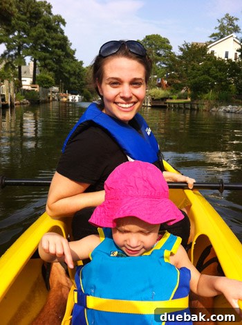 Bethany Beach Bliss: A Delaware Getaway 40 Clara sitting comfortably in the front of a tandem kayak on the canal.