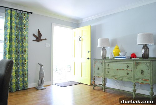 Elevate Your Dining Buffet Decor 12 Entryway view with yellow front door and buffet