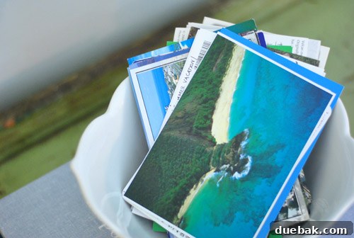 Elevate Your Dining Buffet Decor 10 Close up of the scalloped bowl with vacation postcards