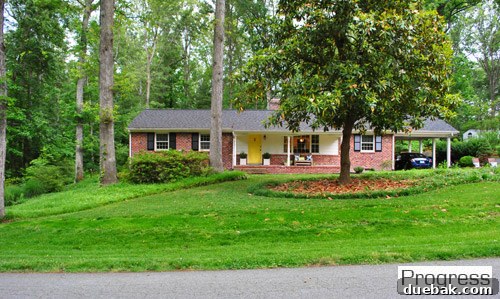 Listy McListerson Refreshed 2 Our front yard after initial landscaping, showing a manicured magnolia tree and newly updated garden beds, enhancing curb appeal.
