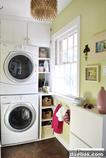 Listy McListerson Refreshed 11 Our narrow, almost-complete laundry room with cork flooring, painted cabinets, a custom clothespin chandelier, and organized storage.