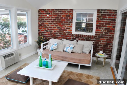 Listy McListerson Refreshed 15 The sunroom, currently empty and awaiting its transformation into a bright, inviting space with whitewashed brick and unique ceiling detail.
