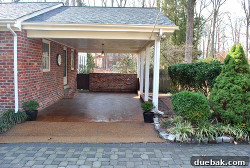 Listy McListerson Refreshed 4 The current carport area, an undeveloped space slated for a future conversion into a functional garage with aesthetic enhancements.