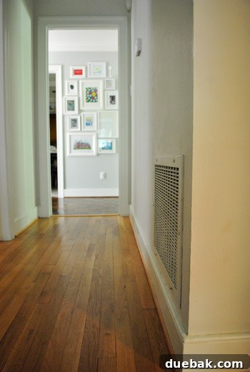 Listy McListerson Refreshed 9 The small, unimproved hallway, a blank canvas awaiting transformation with wainscoting, new paint, and updated doors.