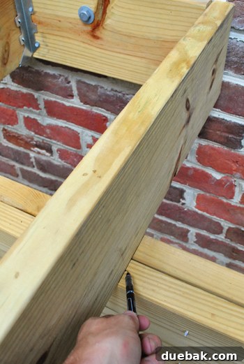 Laying the Groundwork for Your Deck 14 Deck girders extending past the framing line, needing to be trimmed