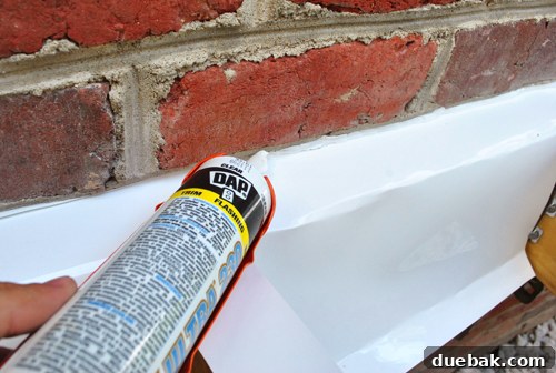 Laying the Groundwork for Your Deck 21 Applying clear silicone caulk to seal the counter flashing in the brick mortar joint